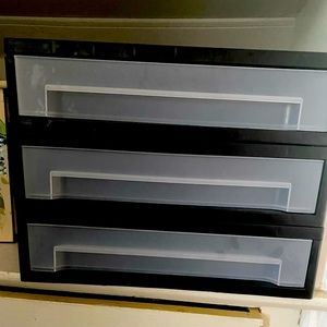 Desktop organizer/monitor riser with pull out storage drawer. Plastic.
